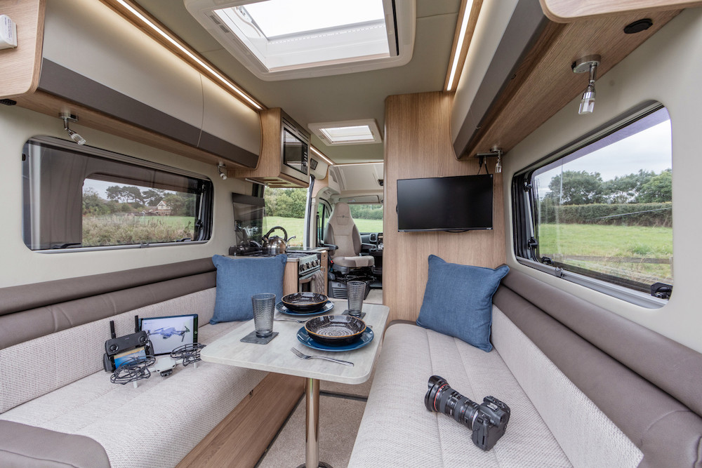 Interior view of a 2023 Auto-Trail V-Line SE 540 camper van looking towards the front of the vehicle.