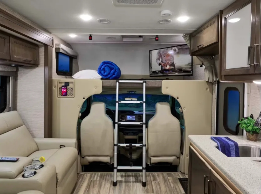 Interior of Thor Four Winds Class C motorhome showing the bed over the cab.