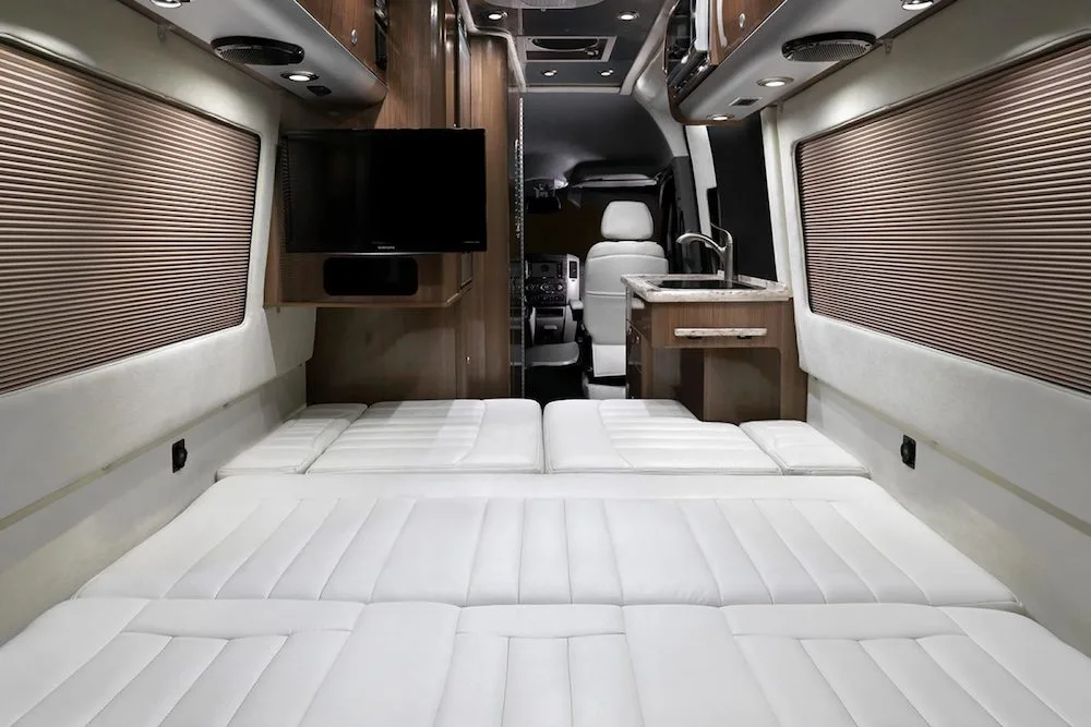 Bed area of a Airstream Interstate camper van.
