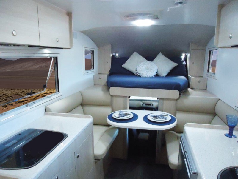 The Best Compact Motorhome - Explorer Spirit has a unique pull-out bed style that allows you to utilise the space above the cab without have to clamber up or over your partner.