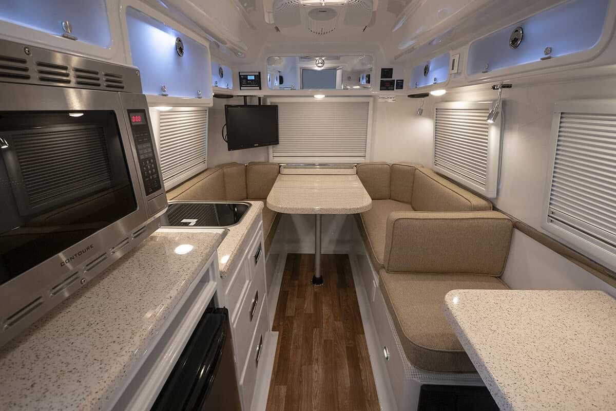 White interior of a Oliver Travel Trailers looking towards the rear