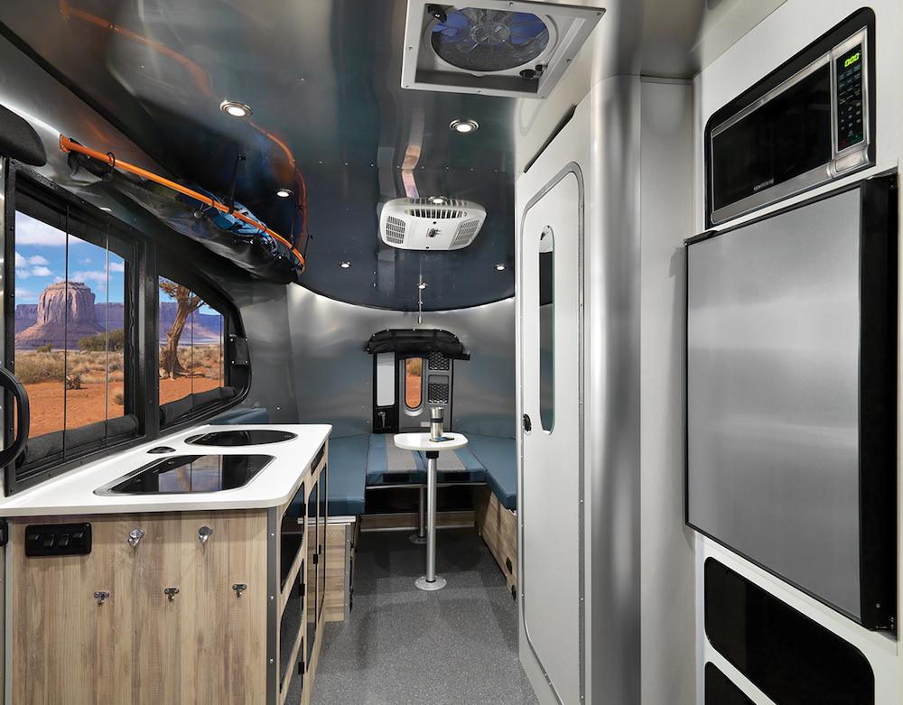 Interior of Airstream Basecamp lightweight travel trailer looking towards the rear.