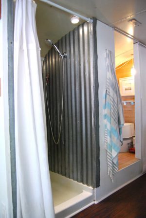RV Bathroom Renovations - corragated metal on the walls of the shower and it still manages to look cool and funky!?