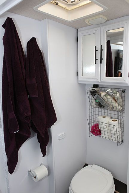 Small Bathroom Storage Ideas - Shelves or baskets above the toilet are the perfect place for storage.