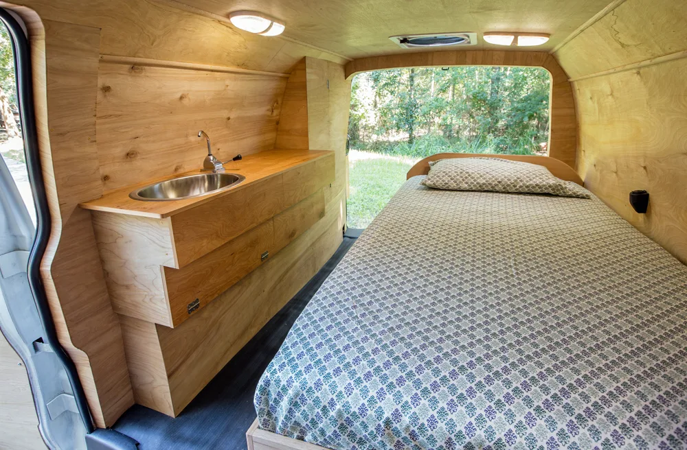 Sprinter Van Conversions - I love the idea of living so small and mobile, but with all the creature comforts of home. Graceful and minimalist, this van conversion looks perfect for a single person, living and even working from the road.