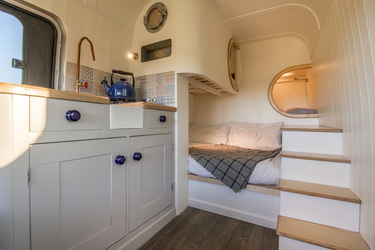 Sprinter Van Conversions - I love the idea of living so small and mobile, but with all the creature comforts of home. Designed to sleep a family of four, this sprinter van conversion is stunning.