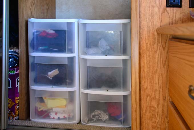 Storage ideas for RV Closets - When you don't have enough space for all your clothes but you still want to look nice while traveling, it's important to organize what space you do have! Add plastic drawers to unused hanging space.