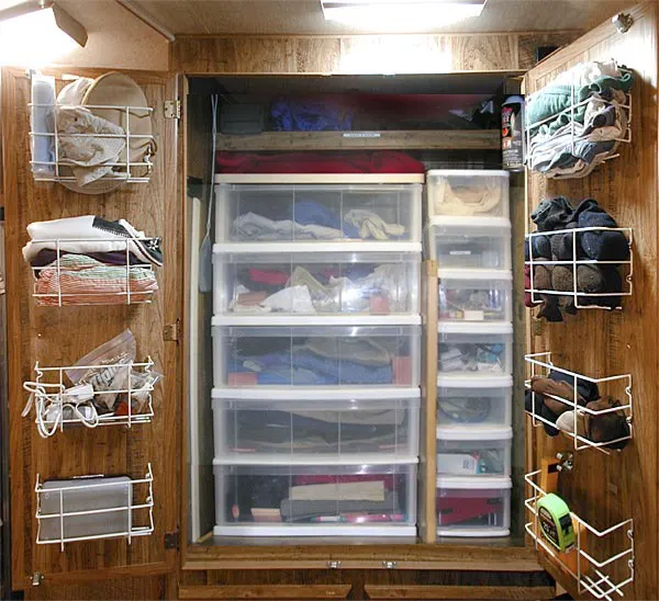Storage ideas for RV Closets - When you don't have enough space for all your clothes but you still want to look nice while traveling, it's important to organize what space you do have! Make the most of ALL the space by adding some wire baskets to the inside of the closet door.